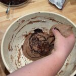 chocolate sourdough bread with homemade chocolate sauce. Stretch and fold being performed.