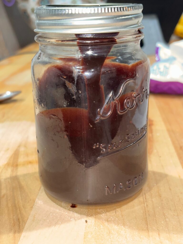 Homemade Chocolate sauce in a glass jar