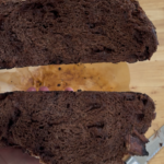 Chocolate sourdough loaf cut in half and showing the inside