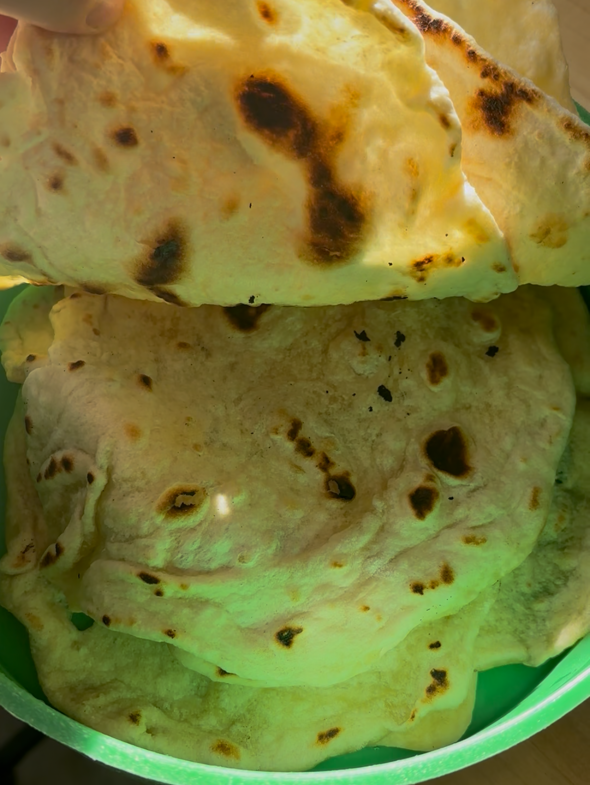 Sourdough Tortillas stacked in a container