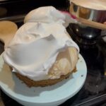 Covering the baked Alaska with Meringue