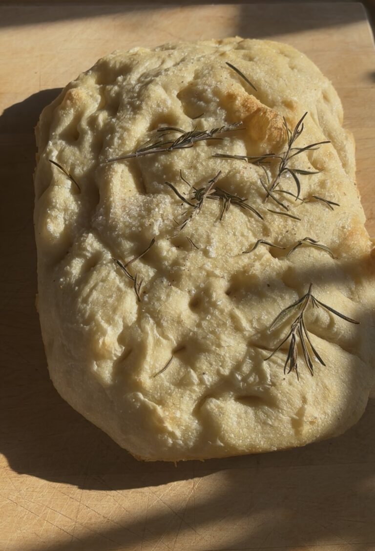 Baked Sourdough Focaccia with rosemary and flaky salt on top.