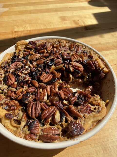 Pecan pie with a slice cut out